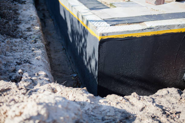 Professional Interior Drainage System technician working in Mantoloking, NJ
